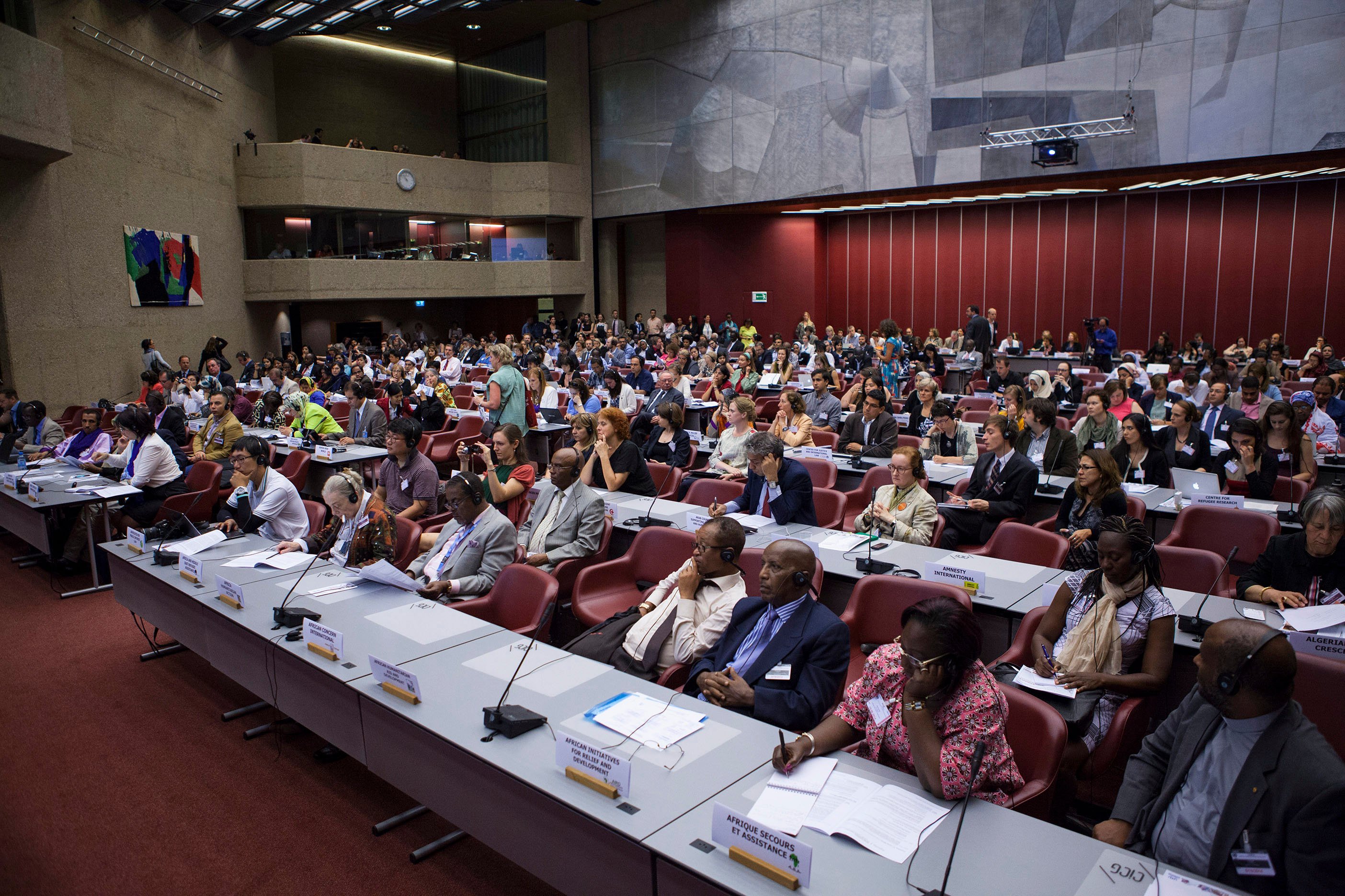 Attendees at the International Conference Center Geneva, Switzerland A room in a conference center full of people